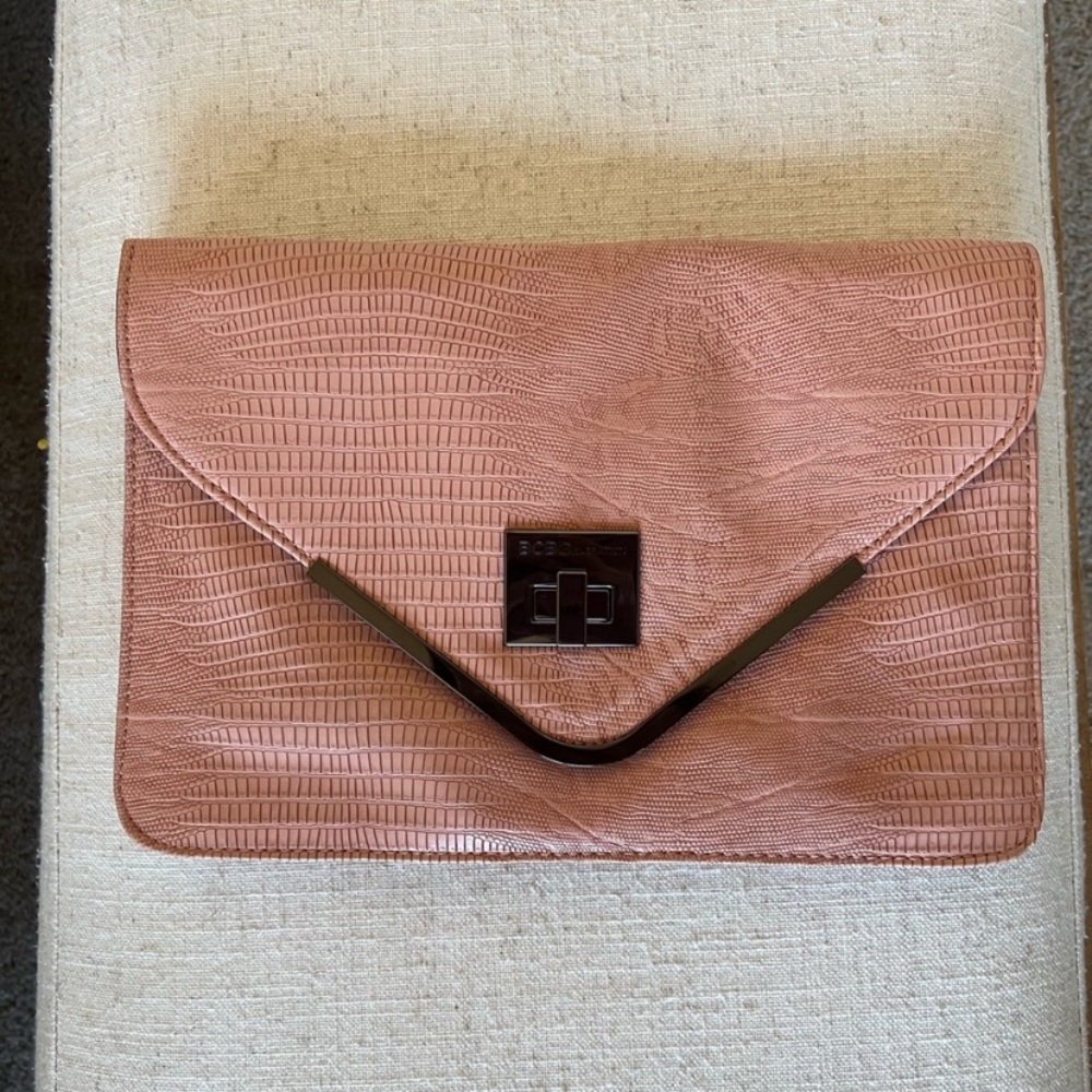 NWOT BCBG pink snake envelope clutch